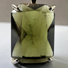 Faceted Moldavite pendant - Emerald cut 7.09 carat.