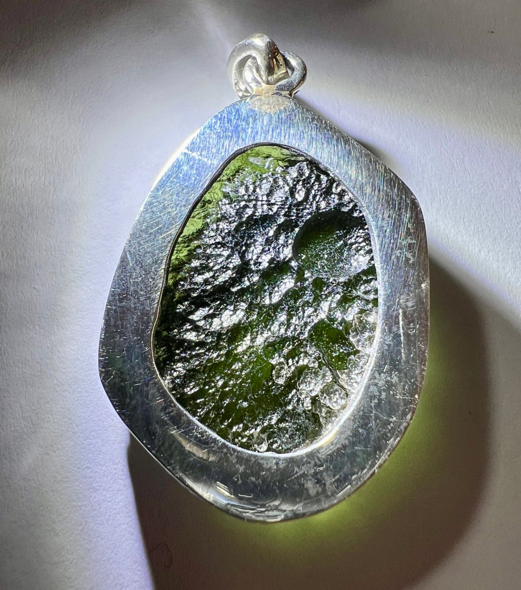 9.43g Bezel set Moldavite pendant.