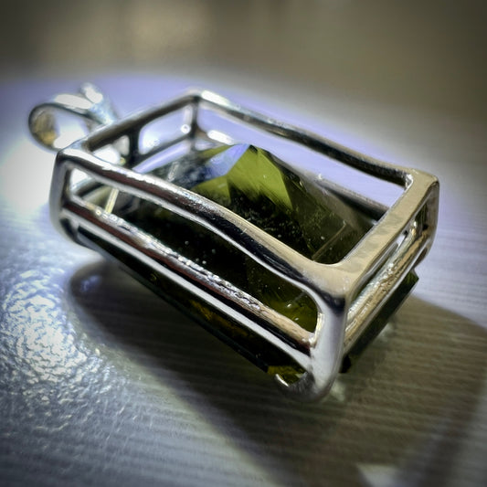 Faceted Moldavite pendant - Emerald cut 7.11 carat.