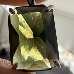Faceted Moldavite pendant - Emerald cut 7.11 carat.