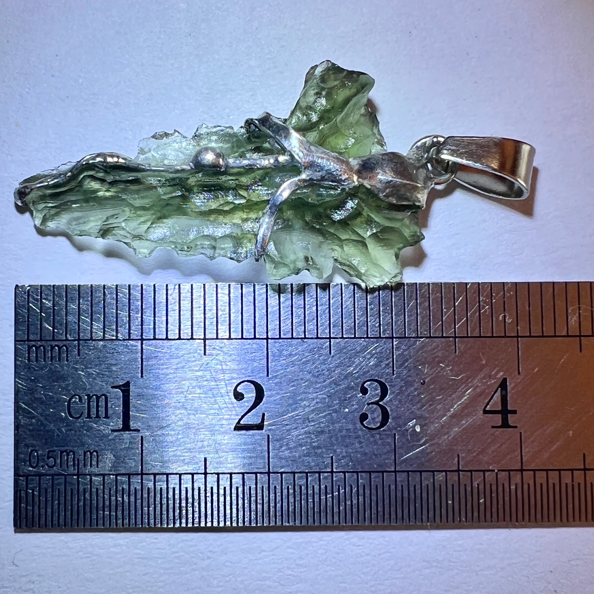 Moldavite Hedgehog pendant.