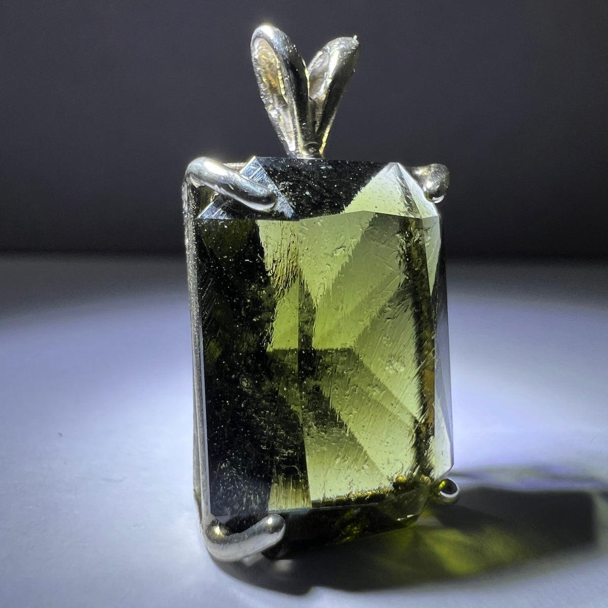 Faceted Moldavite pendant - Emerald cut 7.09 carat.