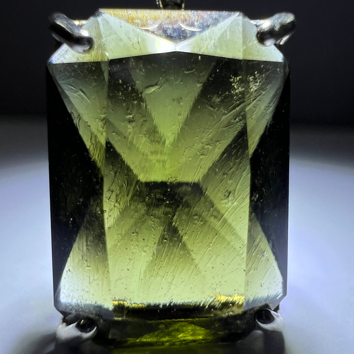 Faceted Moldavite pendant - Emerald cut 7.09 carat.