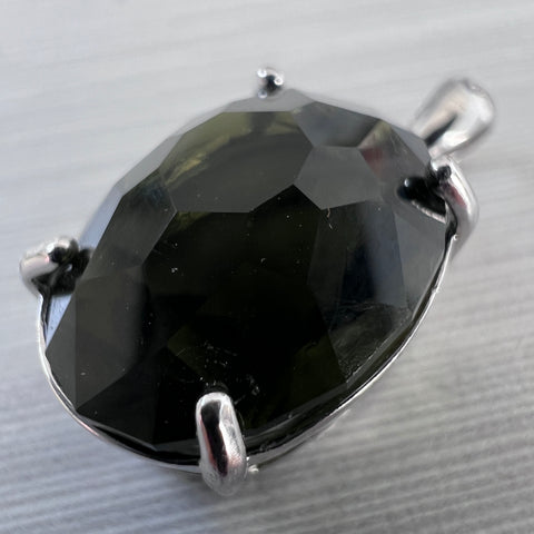 Exquisite Oval-Cut Faceted Moldavite Pendant — 6.99 ct