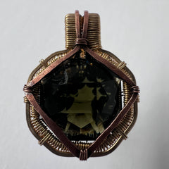 Faceted Moldavite in Gold Wrap - 6.69k Emerald Cut.