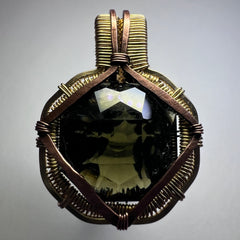 Faceted Moldavite in Gold Wrap - 6.69k Emerald Cut.