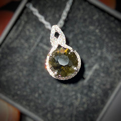 Faceted Moldavite pendant with Zircon 3.28ct