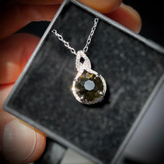 Faceted Moldavite pendant with Zircon 3.28ct